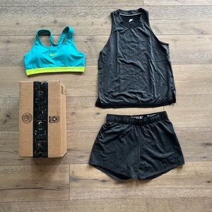 Nike workout gear set includes sports bra, tank top, and matching shorts.